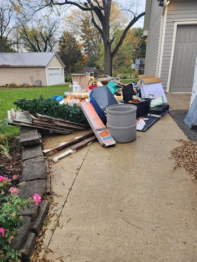 Dumpster being loaded with debris for 12 Yard Dumpster Rental in Palmer Ranch